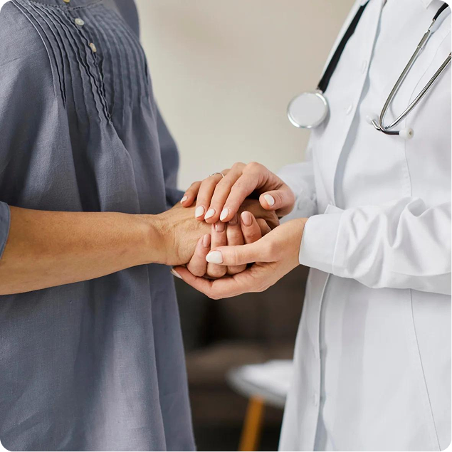 Clinician holding a patient's hands